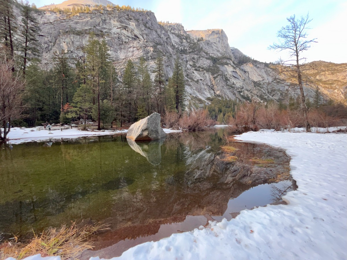 Image of mirror lake at Yosemite with the words Protecting our Planet on it.